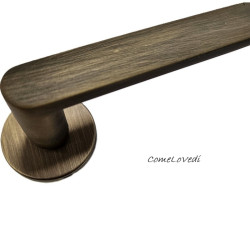 Maniglia da porta NION con copritoppa Patent, colore BRONZO